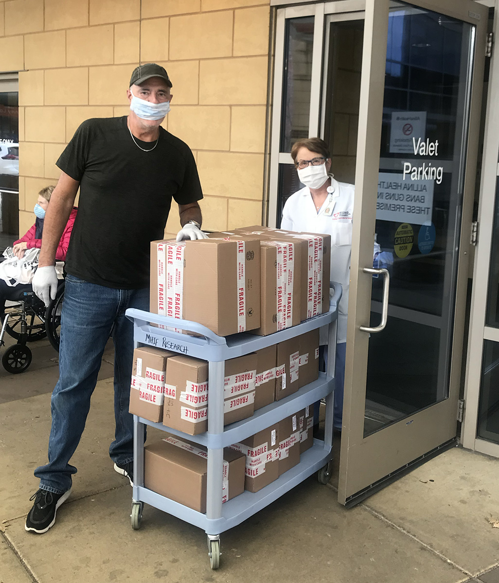Chris Carney delivering boxes of nuts to Abbott Northwestern hospital staff